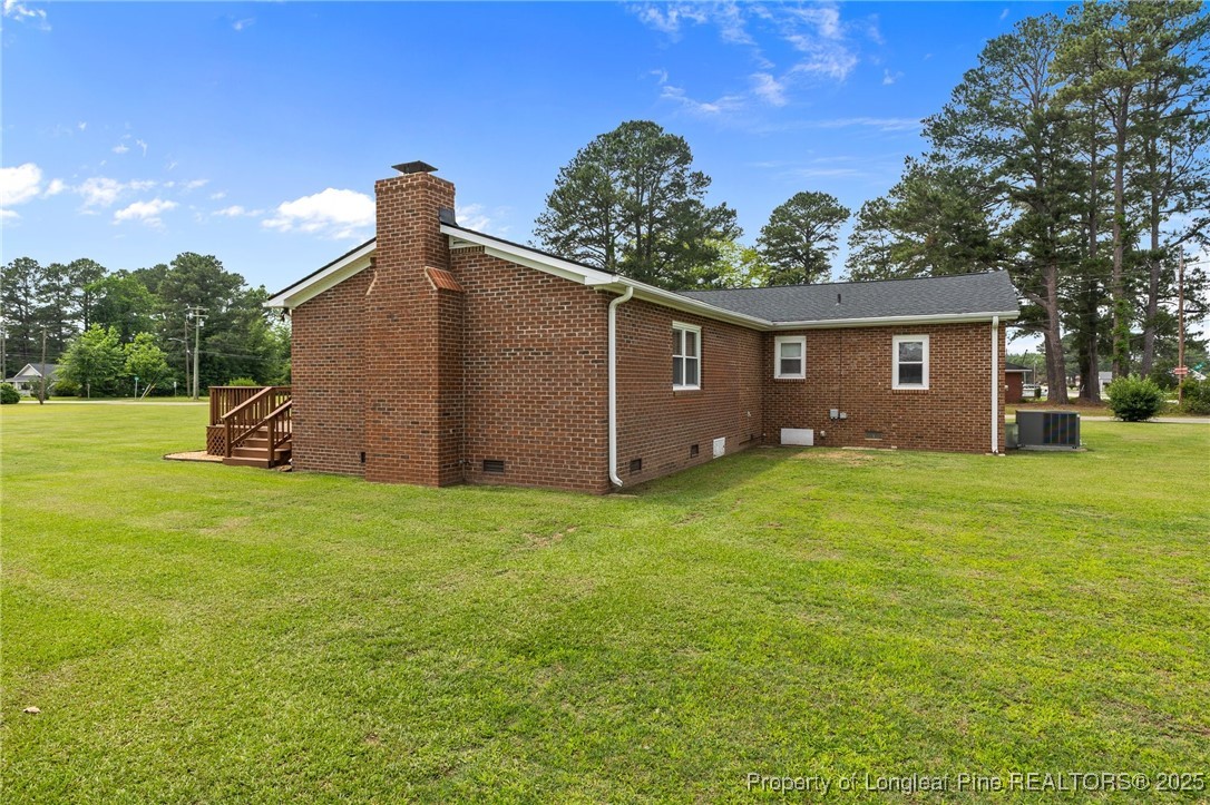 209 4th Street Erwin, NC 28339 - Photo 36 of 43 a view of a backyard of the house
