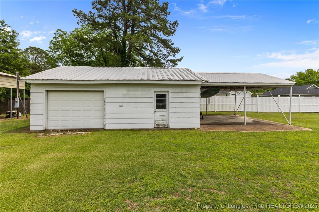 209 4th Street Erwin, NC 28339 - Photo 37 of 43 a backyard of a house with table and chairs