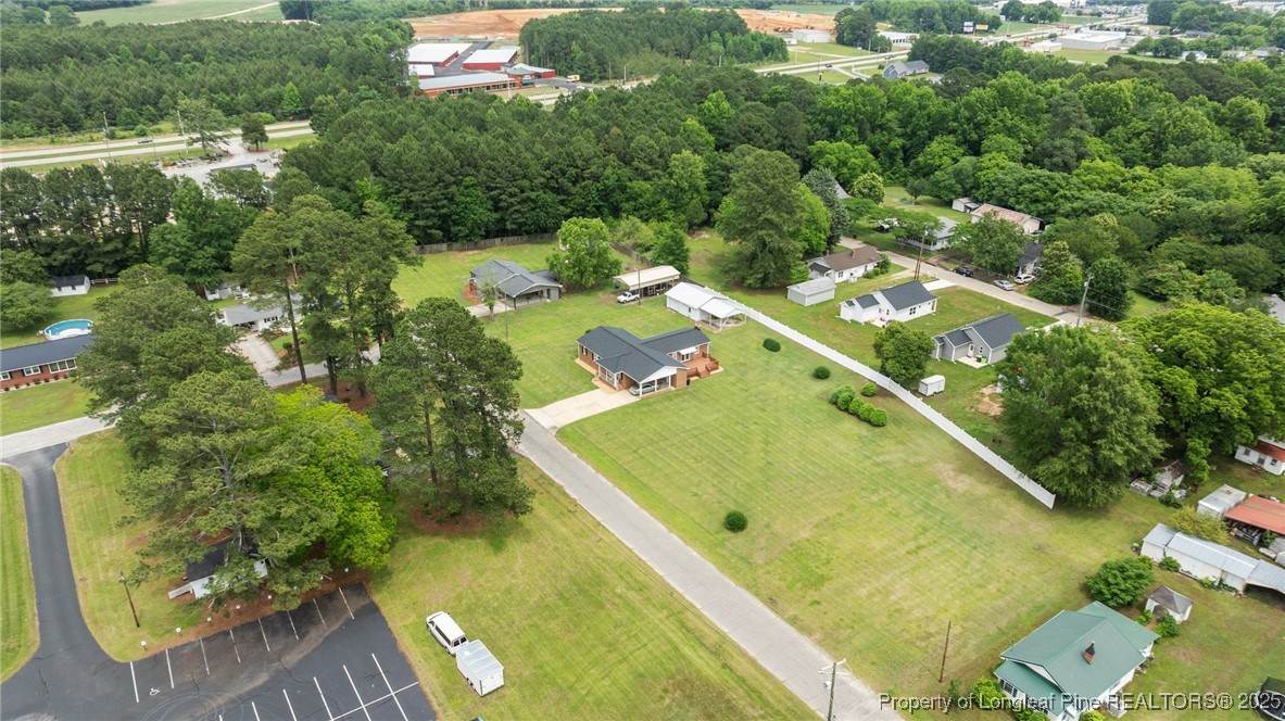 209 4th Street Erwin, NC 28339 - Photo 40 of 43 an aerial view of residential houses with outdoor space