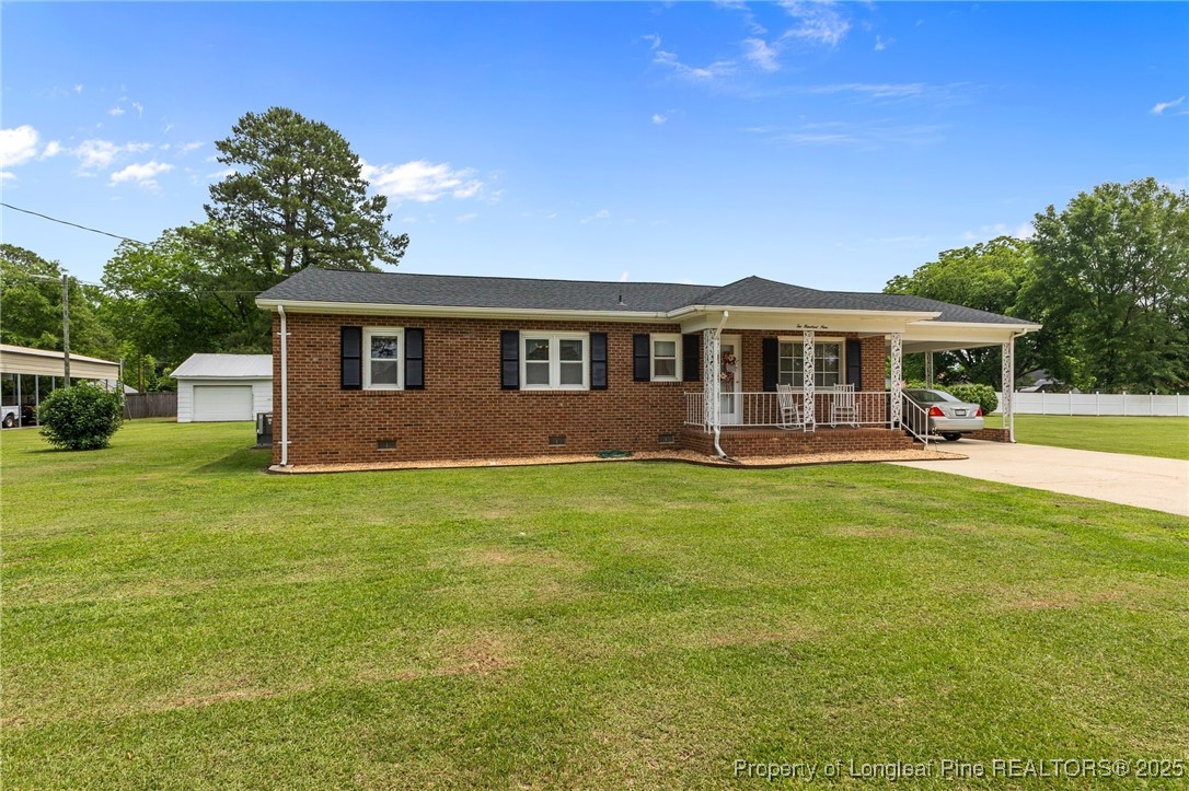 209 4th Street Erwin, NC 28339 - Photo 5 of 43 a view of a house with a backyard