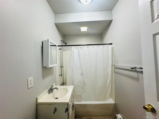 a bathroom with a sink and shower
