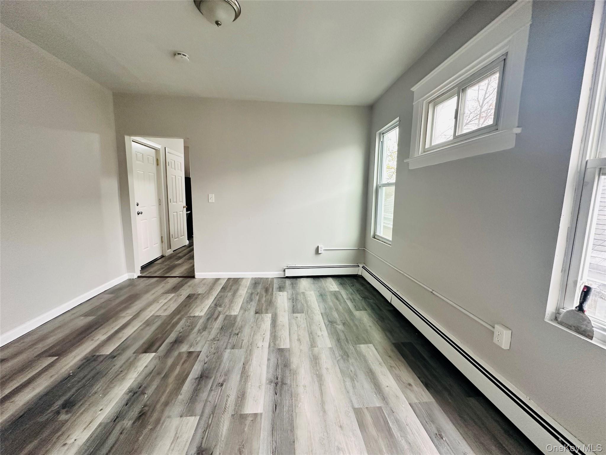 7 Franklin Street, Unit #7 Poughkeepsie, NY 12601 - Photo 2 of 11 a view of a room with wooden floor