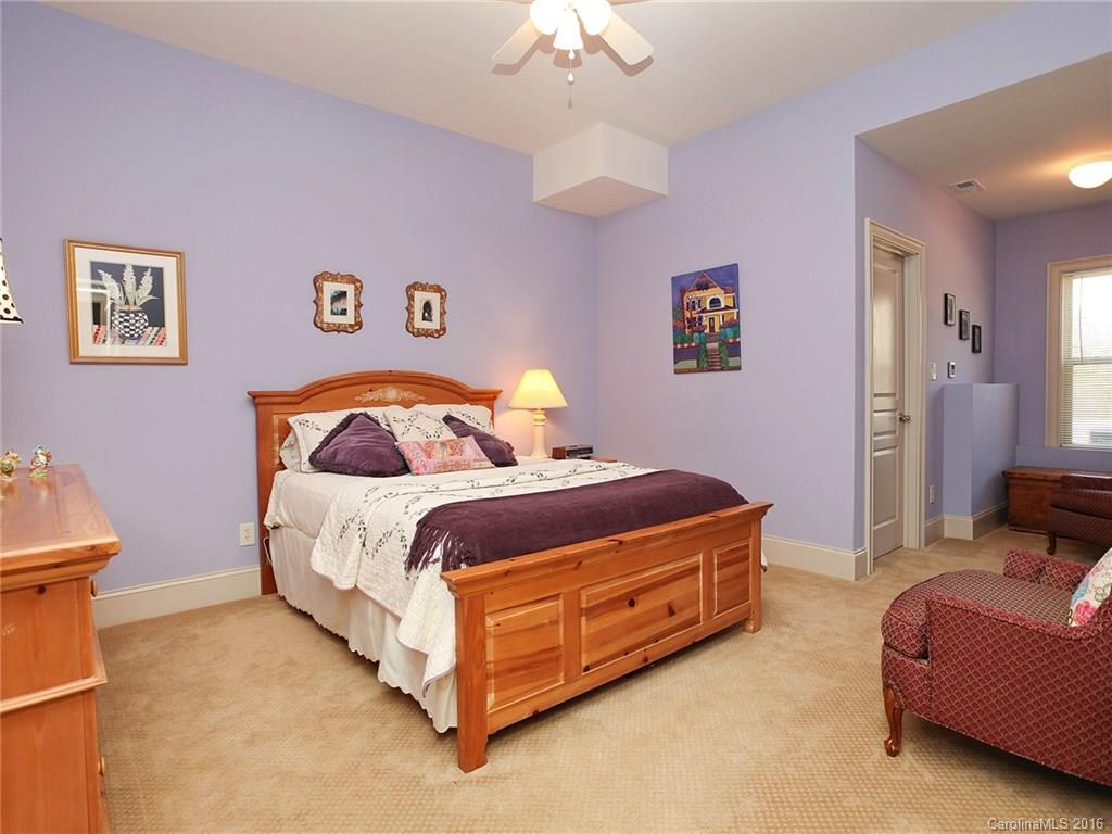 3457 Harmony Road Catawba, SC 29704 - Photo 13 of 24 a bedroom with a bed and a chandelier