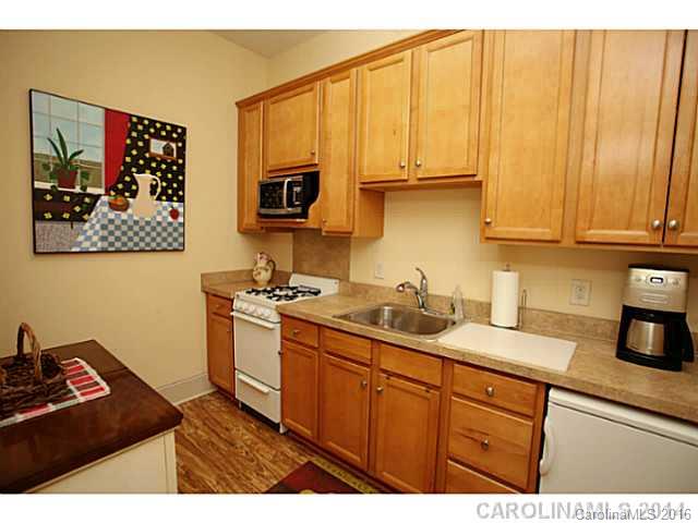 3457 Harmony Road Catawba, SC 29704 - Photo 16 of 24 a kitchen with stainless steel appliances granite countertop a sink stove and microwave