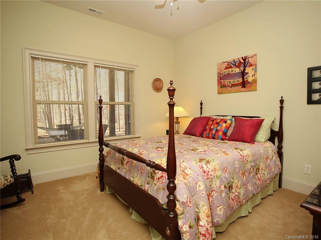 3457 Harmony Road Catawba, SC 29704 - Photo 17 of 24 a bed sitting in a bedroom next to a window