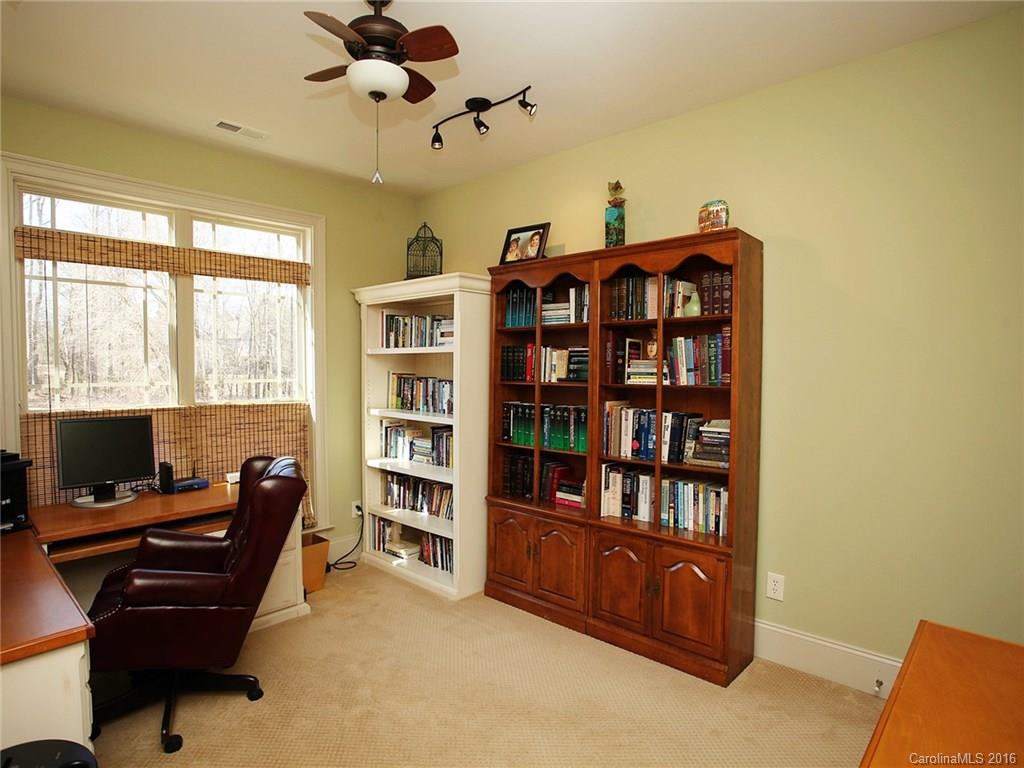 3457 Harmony Road Catawba, SC 29704 - Photo 18 of 24 a view of a workspace with a bookshelf
