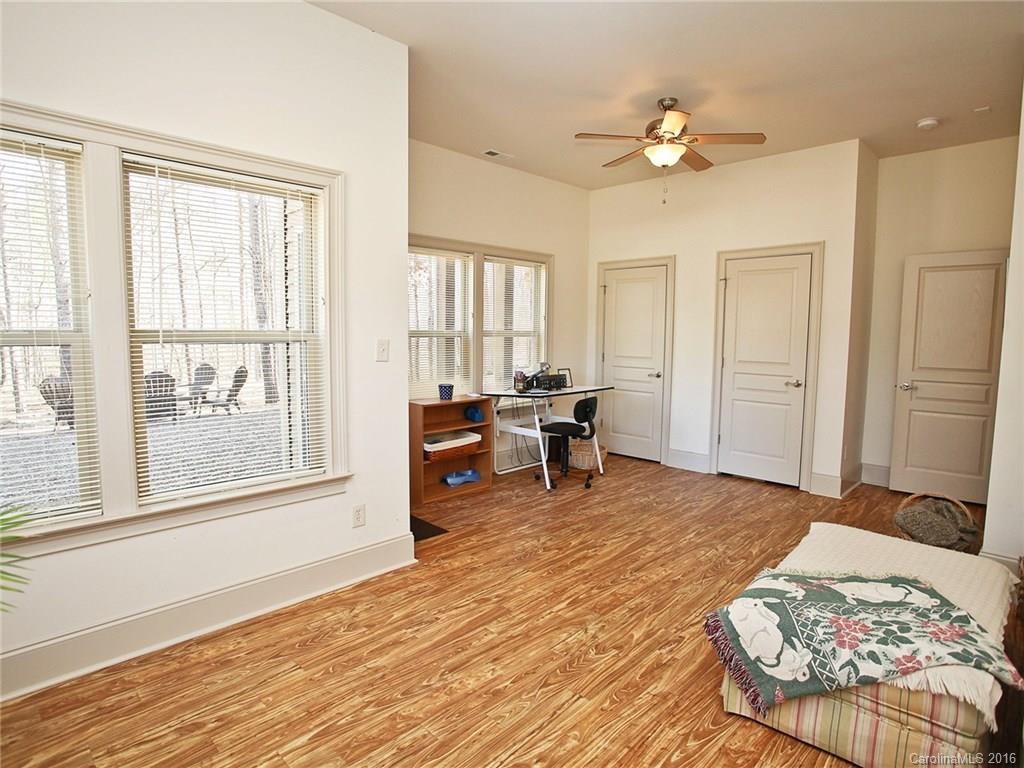3457 Harmony Road Catawba, SC 29704 - Photo 19 of 24 a bedroom with a bed and a large window with chair