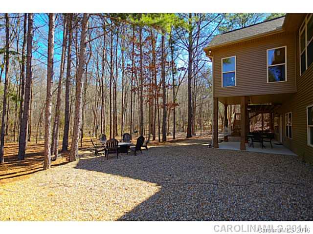 3457 Harmony Road Catawba, SC 29704 - Photo 20 of 24 a backyard of a house with barbeque oven table and chairs