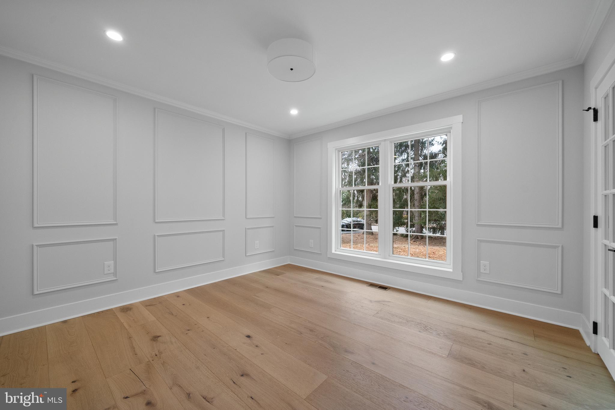 827 Weadley Road Wayne, PA 19087 - Photo 21 of 96 an empty room with wooden floor and windows