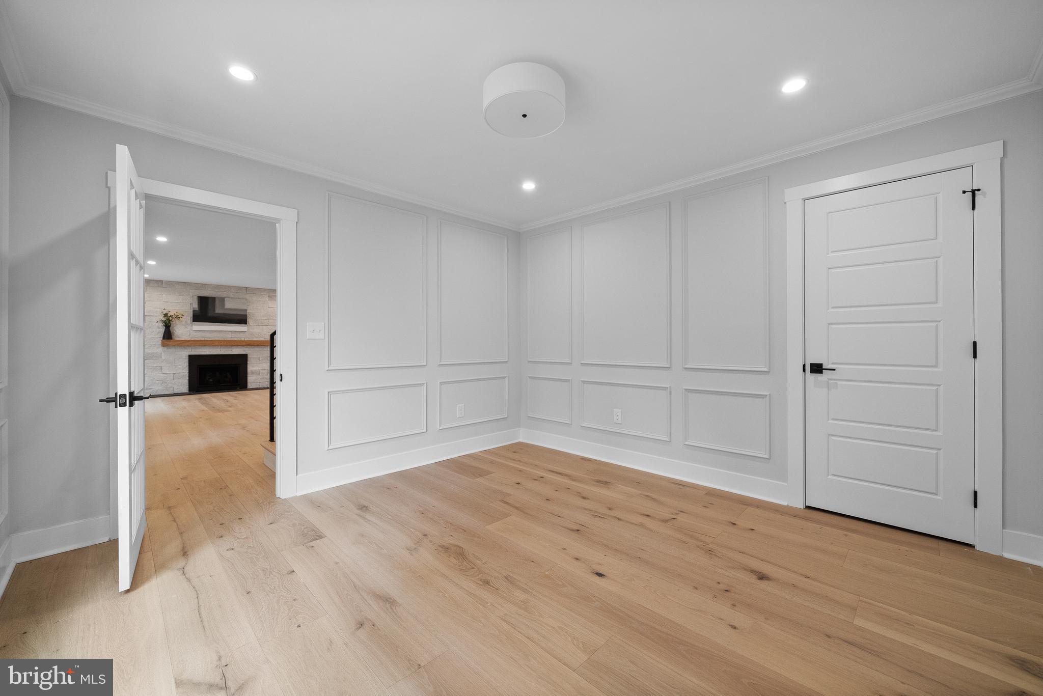 827 Weadley Road Wayne, PA 19087 - Photo 23 of 96 wooden floor in an empty room with a kitchen