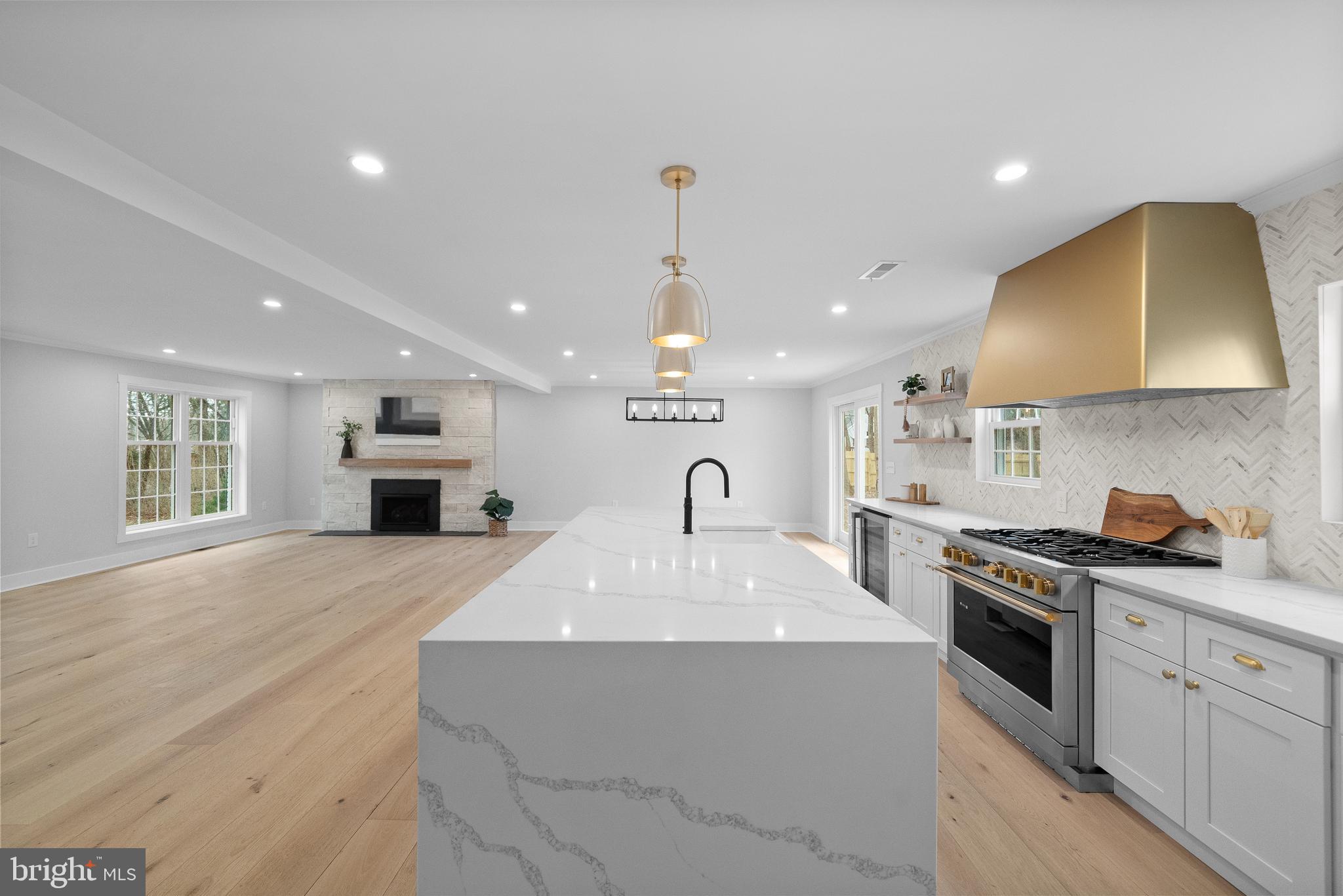 827 Weadley Road Wayne, PA 19087 - Photo 26 of 96 a large kitchen with stainless steel appliances granite countertop a sink a stove and a refrigerator