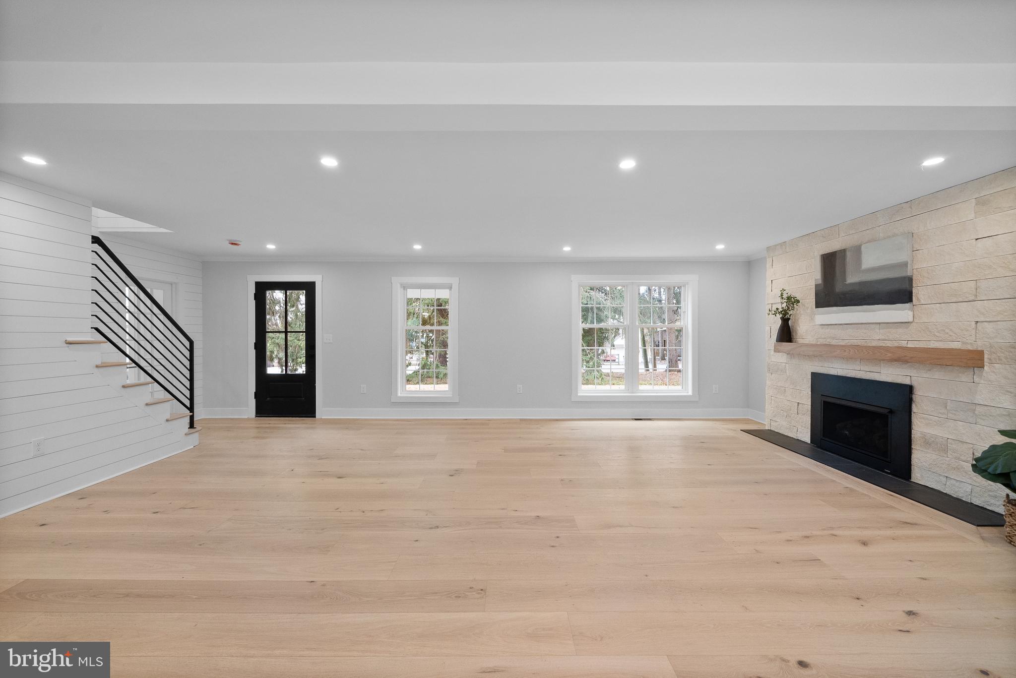 827 Weadley Road Wayne, PA 19087 - Photo 34 of 96 a view of an empty room with a fireplace and a window