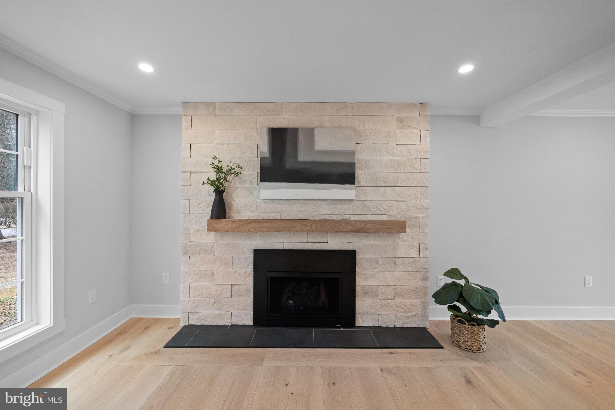827 Weadley Road Wayne, PA 19087 - Photo 37 of 96 a living room with furniture and a fireplace