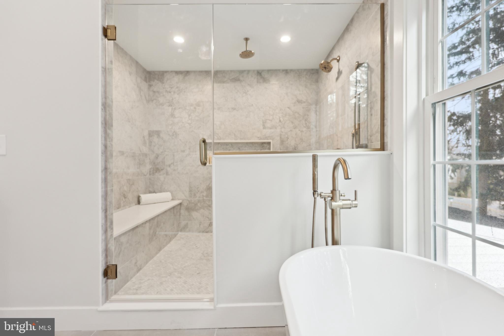 827 Weadley Road Wayne, PA 19087 - Photo 53 of 96 a bathroom with a bathtub and a shower