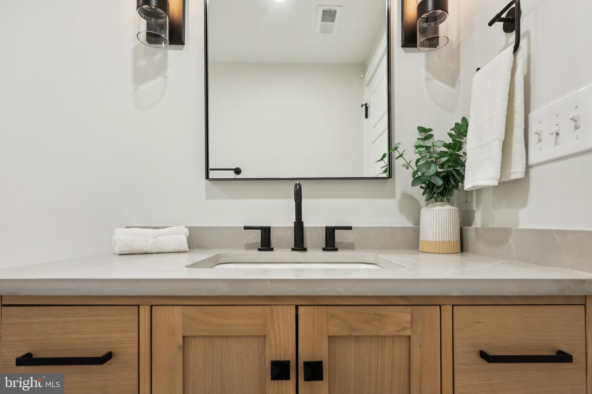827 Weadley Road Wayne, PA 19087 - Photo 63 of 96 a kitchen with a potted plant on the counter and cabinets