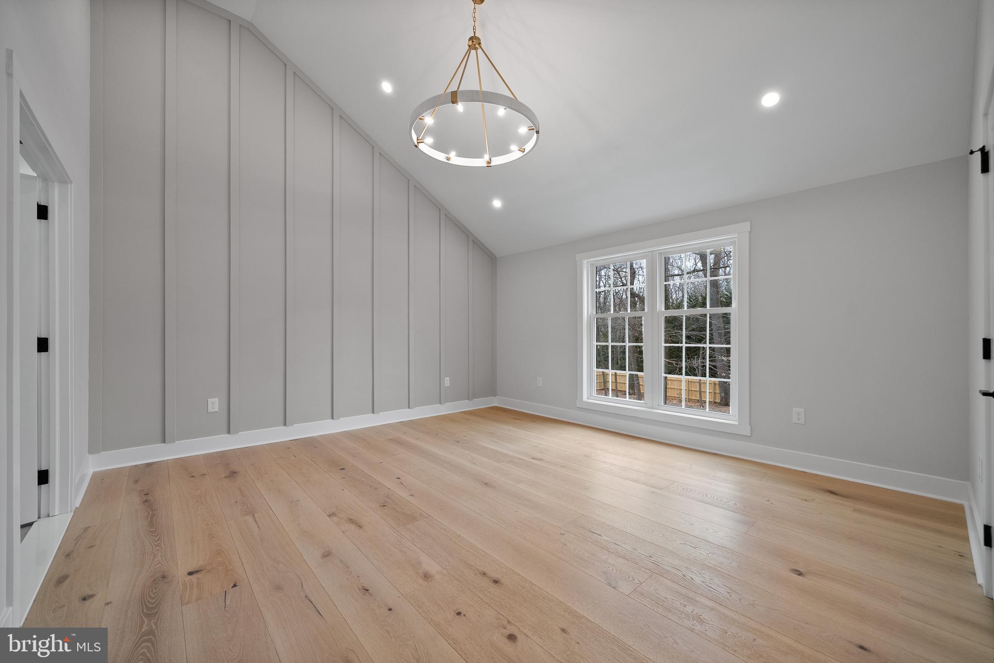 827 Weadley Road Wayne, PA 19087 - Photo 81 of 96 a view of an empty room with wooden floor and a window