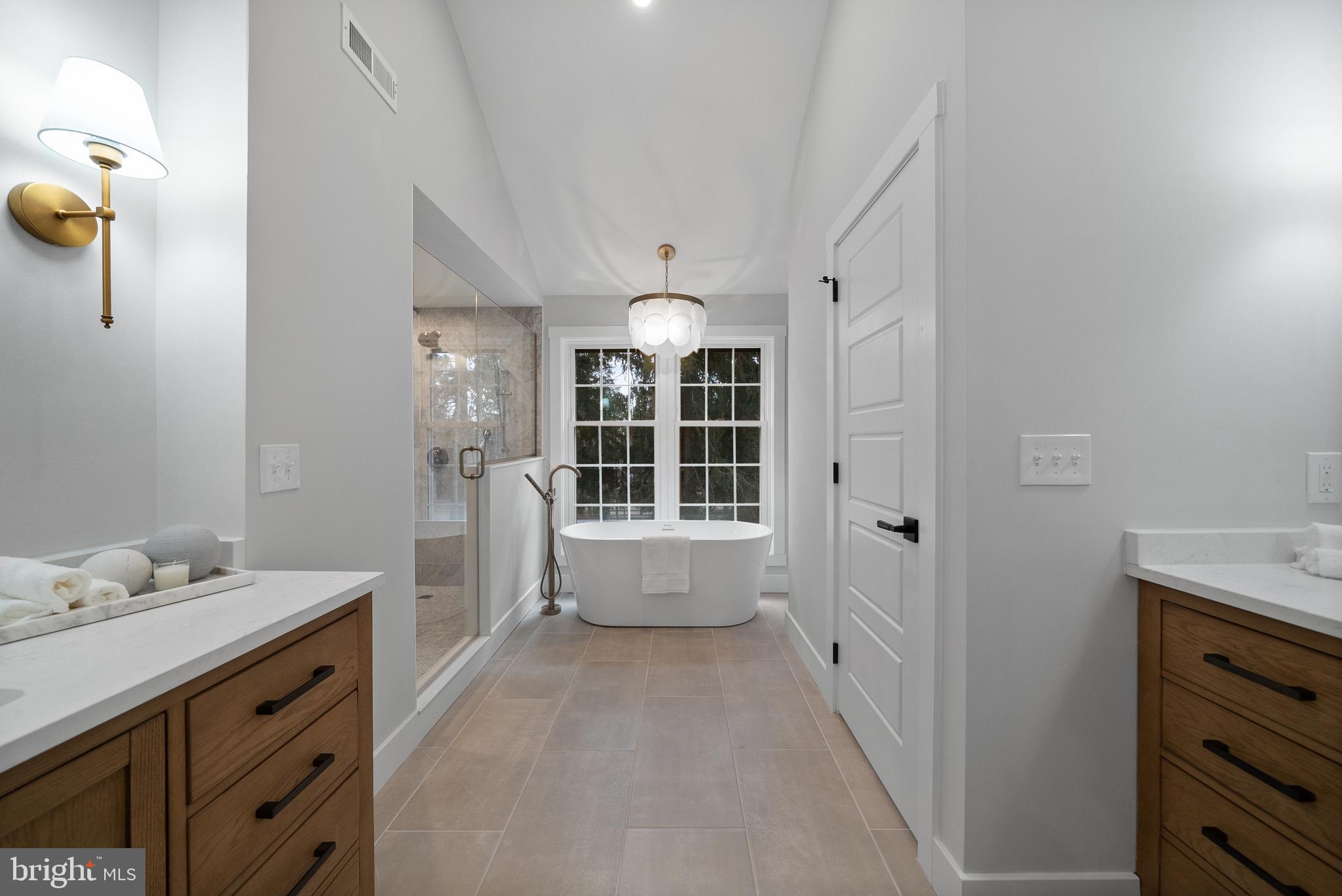 827 Weadley Road Wayne, PA 19087 - Photo 88 of 96 a spacious bathroom with a granite countertop sink mirror and bathtub