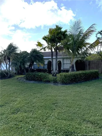 a view of a house with a garden