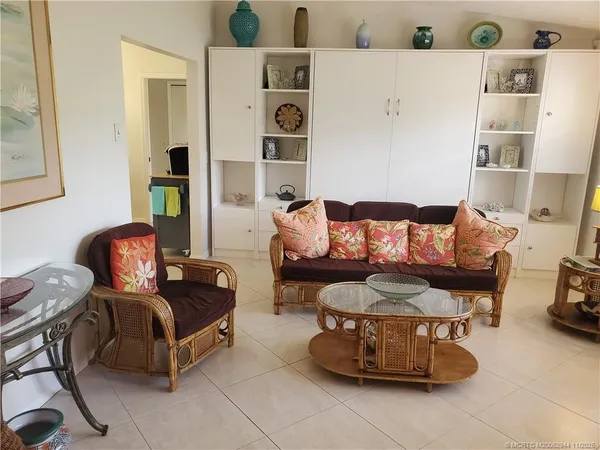 a living room with furniture and white walls