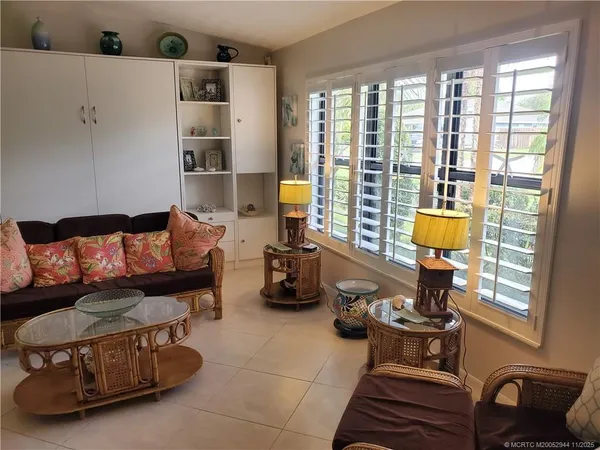 a living room with furniture and a window