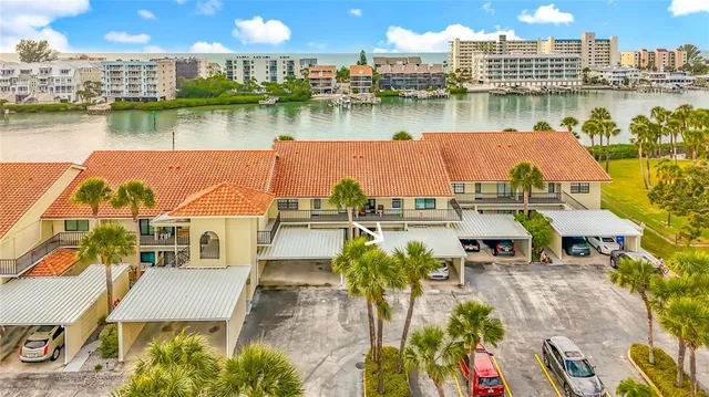 a kitchen with stainless steel appliances granite countertop wooden cabinets stove a sink and dishwasher