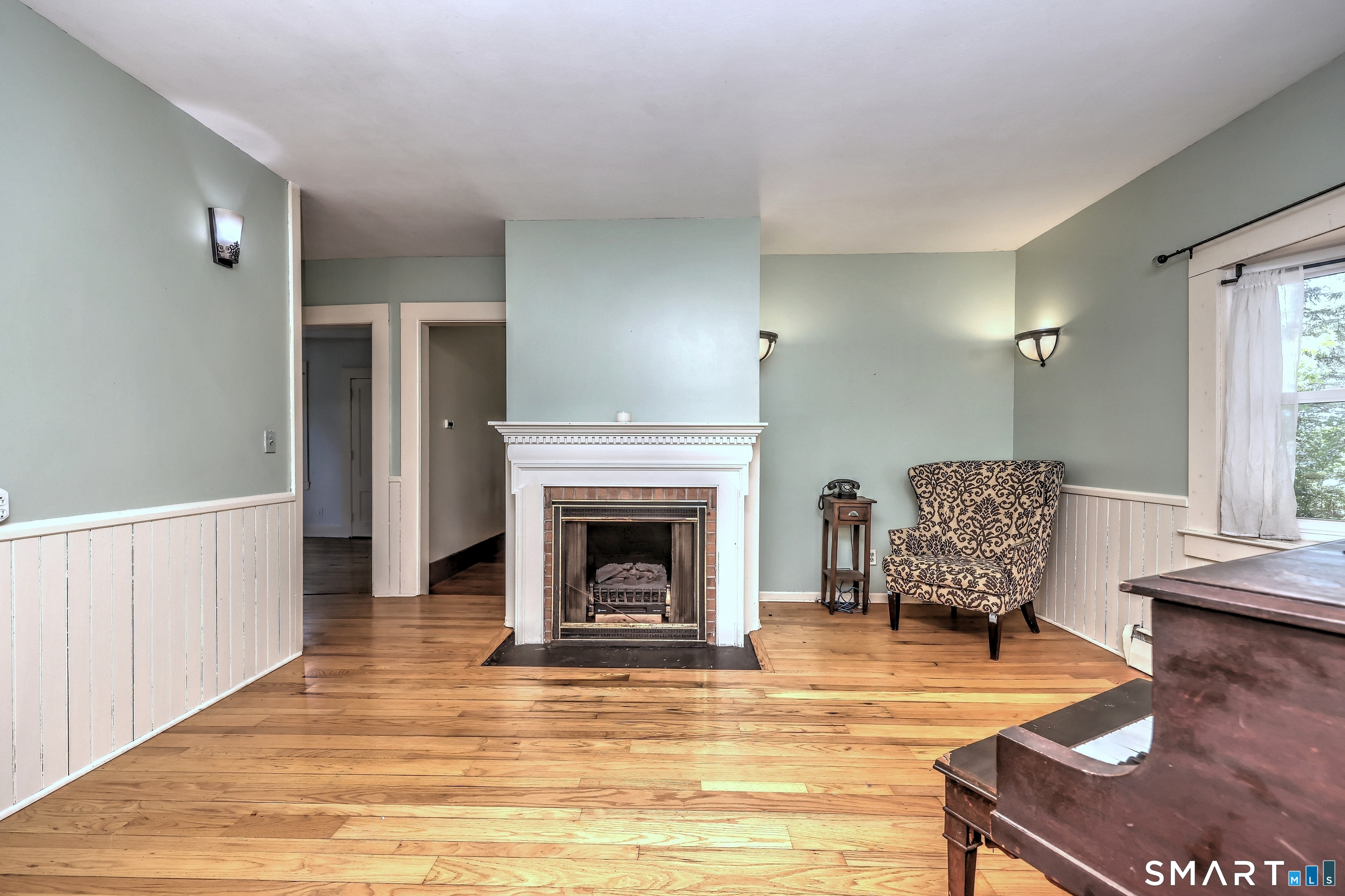 186 Jones Hill Road West Haven, CT 06516 - Photo 18 of 33 a living room with furniture and a fireplace