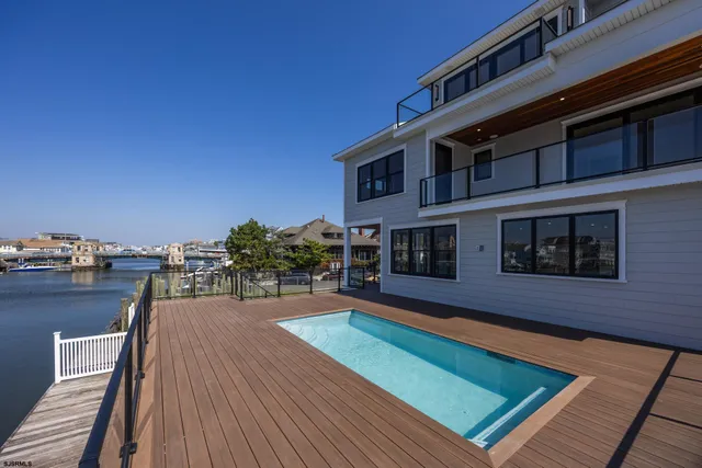 a view of a house with pool on roof deck