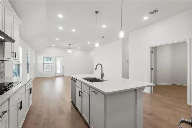a kitchen with a sink and stove