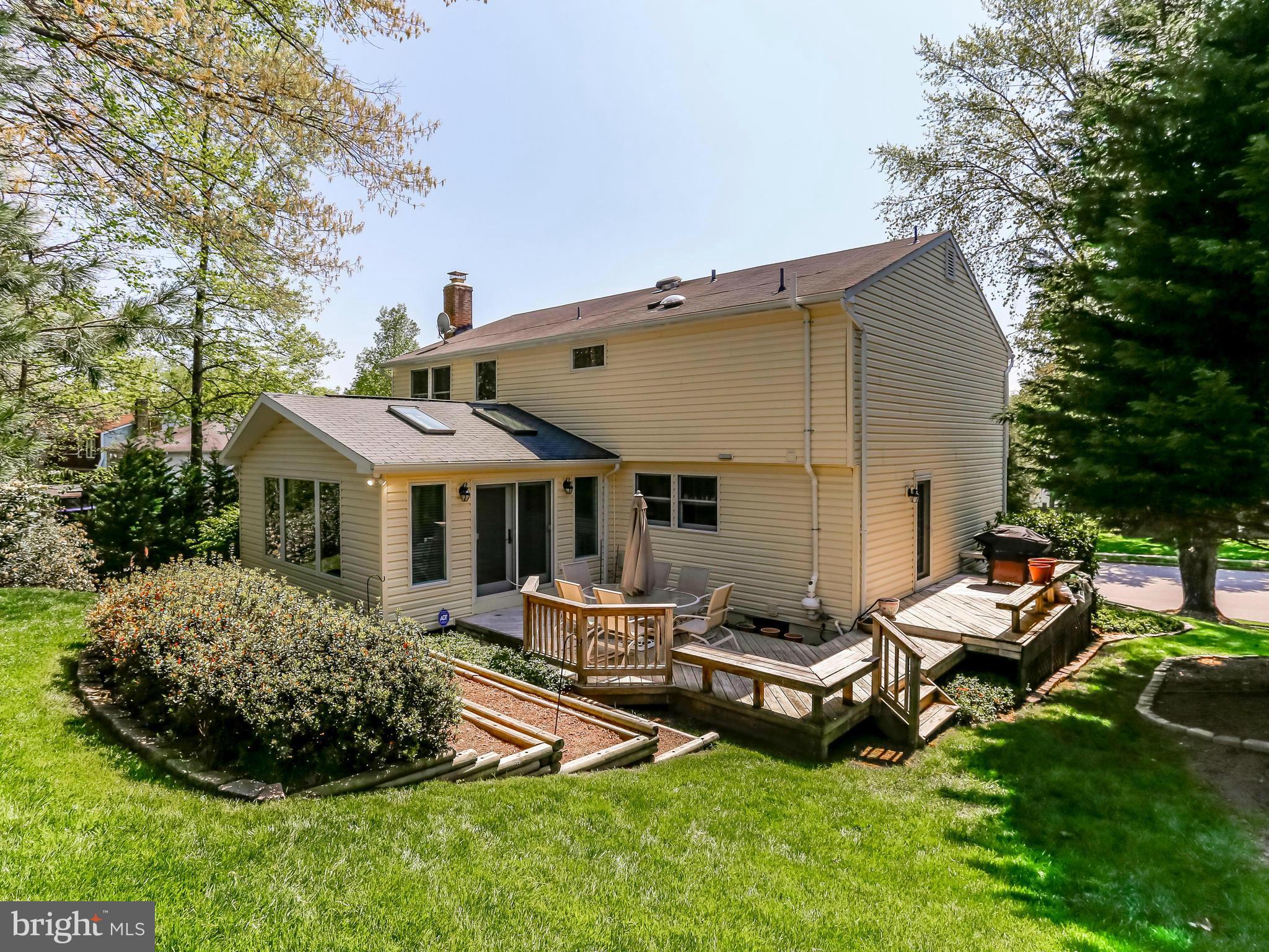 7569 Vogels Way Springfield, VA 22153 - Photo 2 of 28 a view of a house with backyard and sitting area