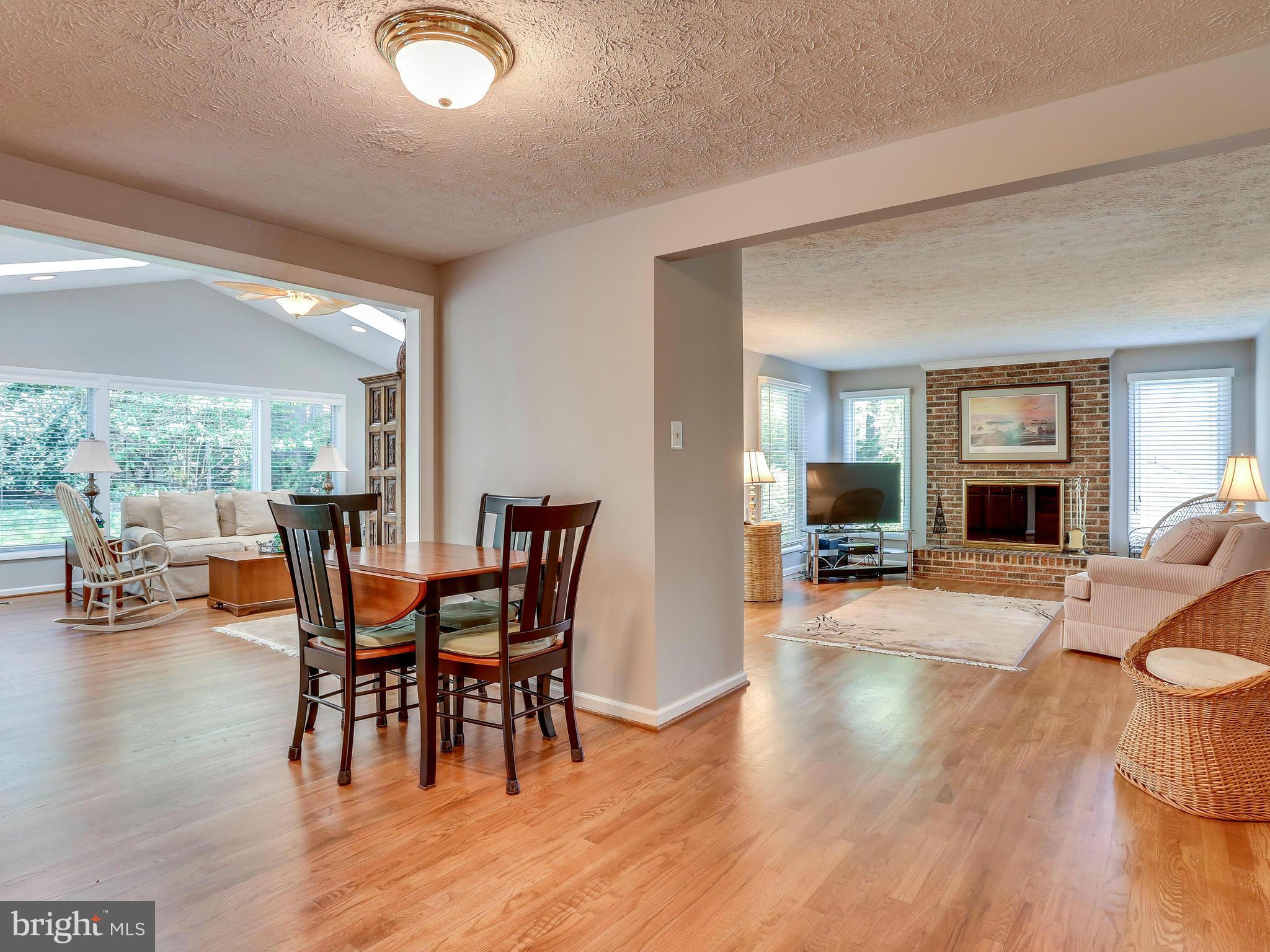 7569 Vogels Way Springfield, VA 22153 - Photo 11 of 28 a view of a dining room with furniture and wooden floor