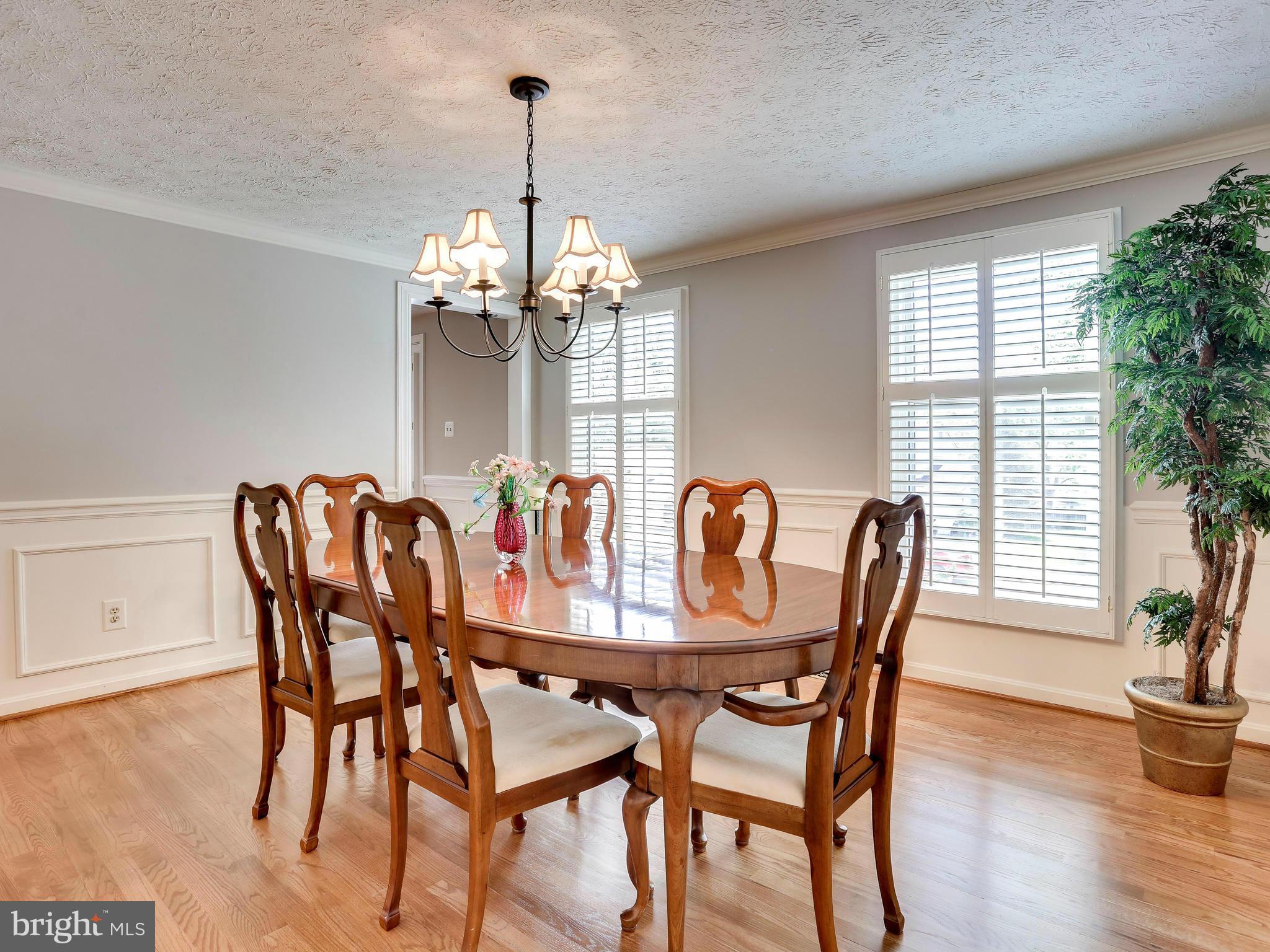 7569 Vogels Way Springfield, VA 22153 - Photo 17 of 28 a view of a dining room with furniture window and wooden floor