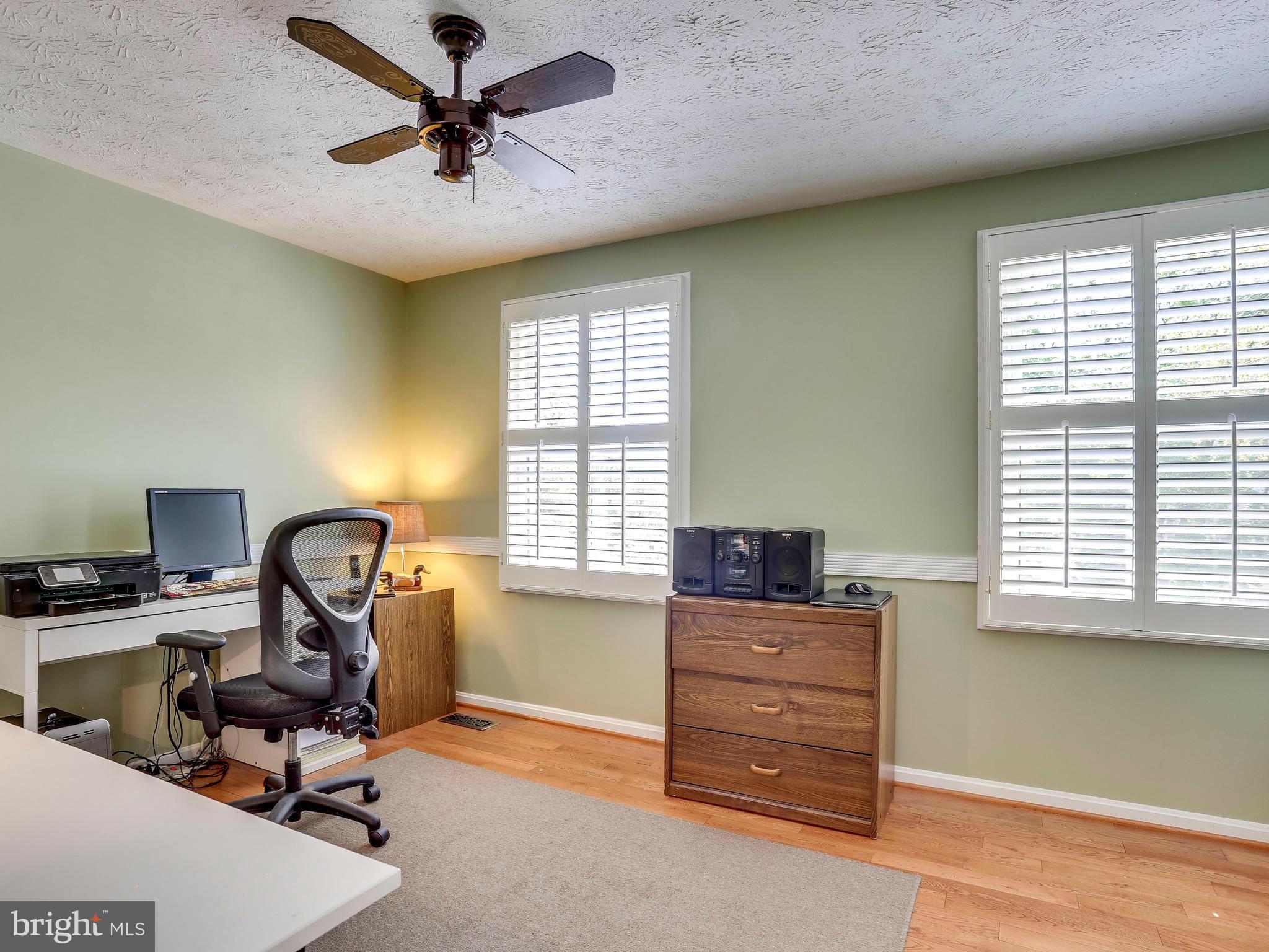 7569 Vogels Way Springfield, VA 22153 - Photo 22 of 28 a view of a workspace with furniture and a window