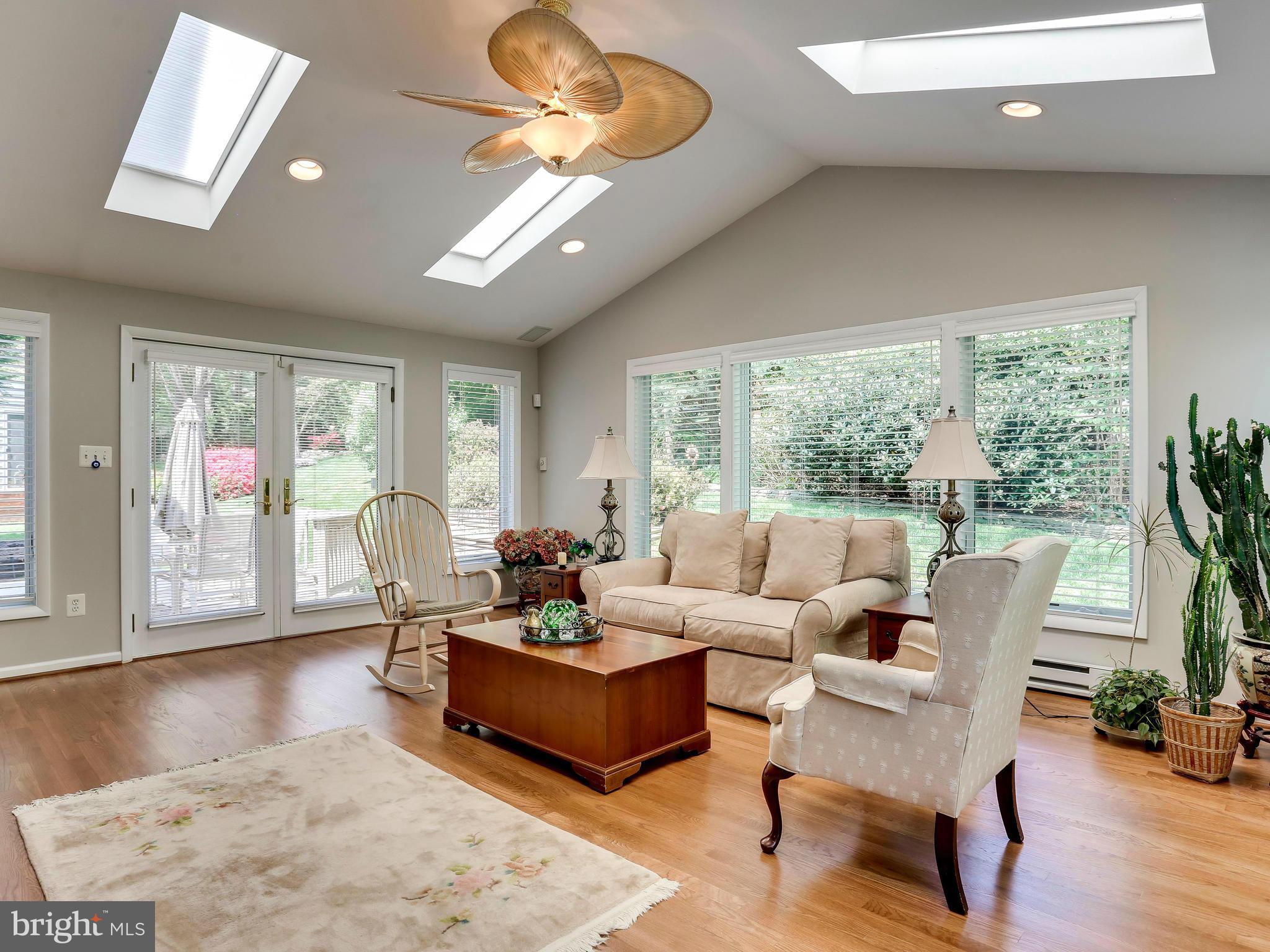 7569 Vogels Way Springfield, VA 22153 - Photo 7 of 28 a living room with furniture and a large window