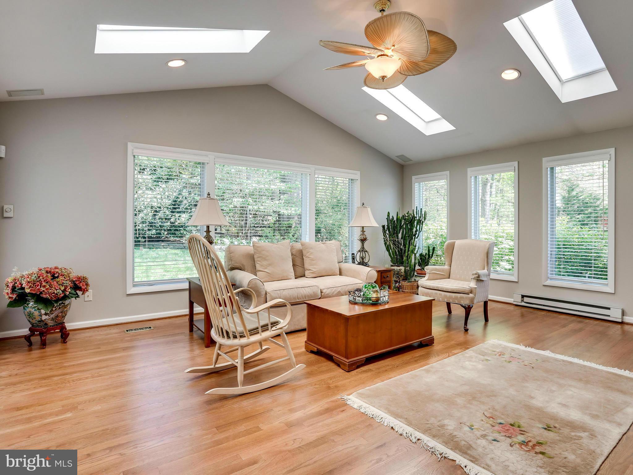 7569 Vogels Way Springfield, VA 22153 - Photo 8 of 28 a living room with furniture and a large window