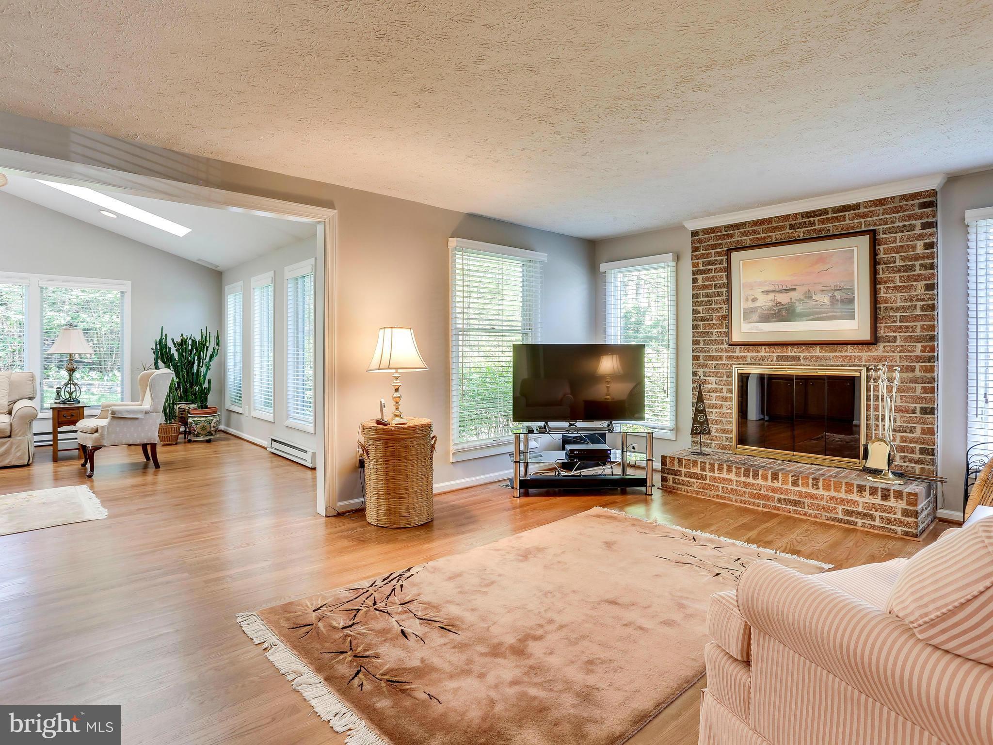 7569 Vogels Way Springfield, VA 22153 - Photo 9 of 28 a living room with furniture and a flat screen tv