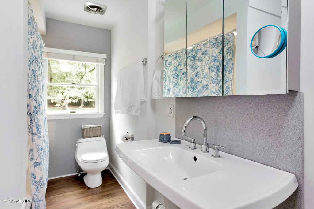 29 Long Meadow Road Riverside, CT 06878 - Photo 11 of 26 a bathroom with a toilet sink and mirror