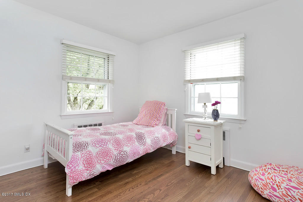29 Long Meadow Road Riverside, CT 06878 - Photo 12 of 26 a bedroom with a bed and a window
