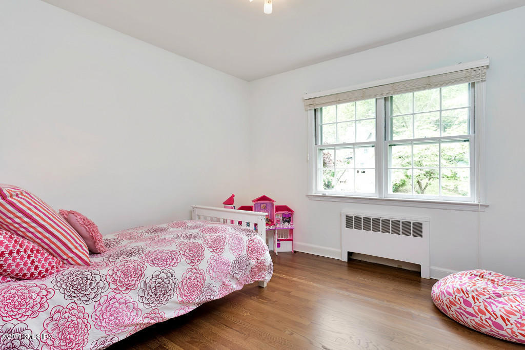 29 Long Meadow Road Riverside, CT 06878 - Photo 13 of 26 a bedroom with a bed and window