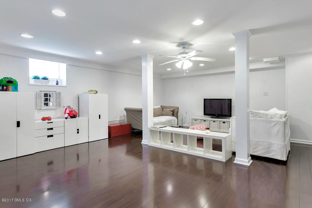 29 Long Meadow Road Riverside, CT 06878 - Photo 16 of 26 a living room with furniture and a flat screen tv
