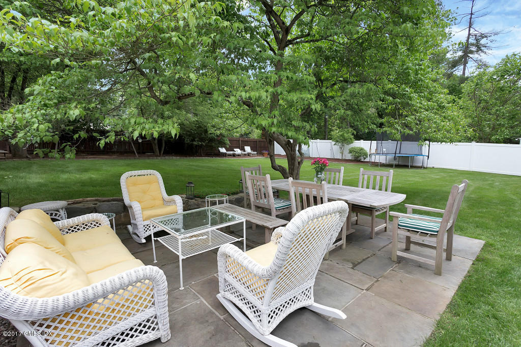 29 Long Meadow Road Riverside, CT 06878 - Photo 19 of 26 a view of a patio with couches chairs and a yard