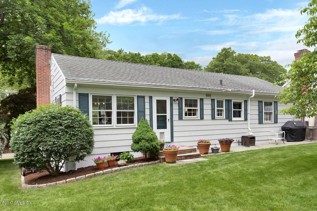 29 Long Meadow Road Riverside, CT 06878 - Photo 22 of 26 a front view of house with yard and green space