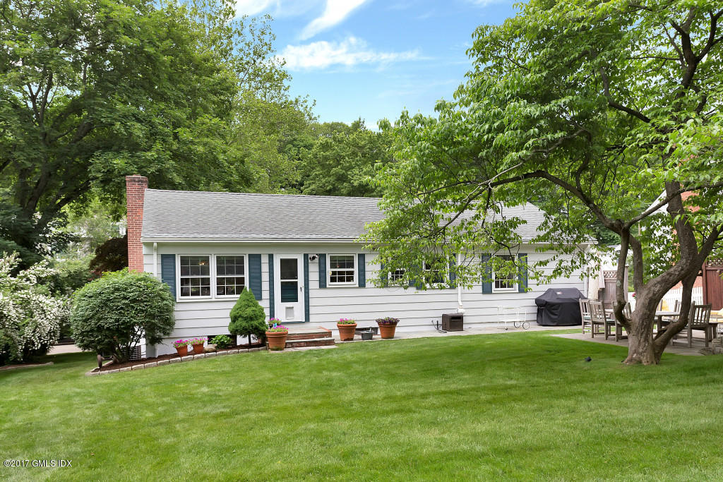 29 Long Meadow Road Riverside, CT 06878 - Photo 23 of 26 a front view of house with yard and green space