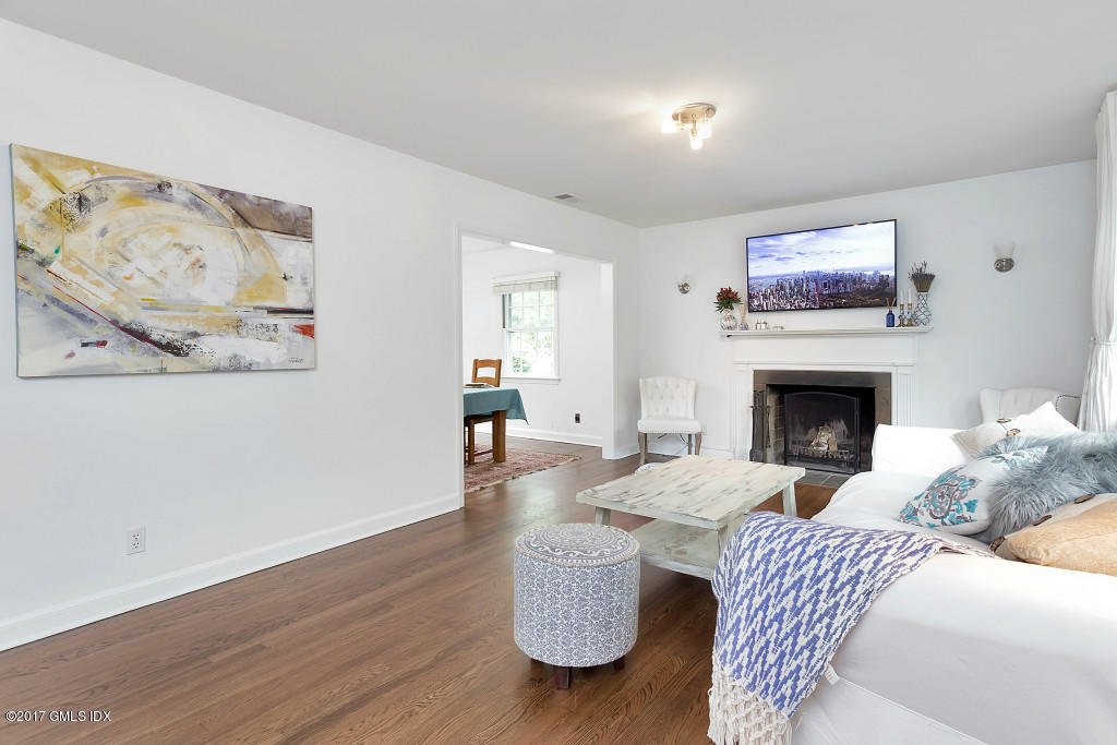 29 Long Meadow Road Riverside, CT 06878 - Photo 3 of 26 a living room with furniture and a fireplace