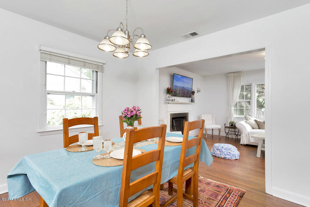 29 Long Meadow Road Riverside, CT 06878 - Photo 5 of 26 a view of a dining room with furniture and a chandelier