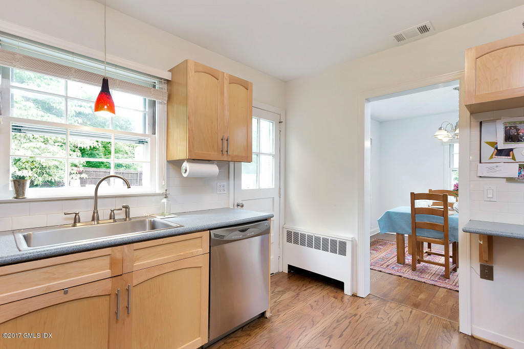 29 Long Meadow Road Riverside, CT 06878 - Photo 7 of 26 a kitchen with cabinets a sink and a large window