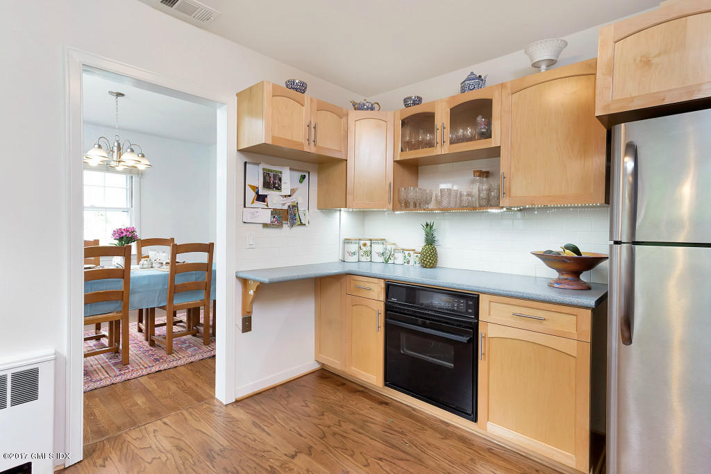 29 Long Meadow Road Riverside, CT 06878 - Photo 8 of 26 a kitchen with stainless steel appliances granite countertop a refrigerator and a stove top oven
