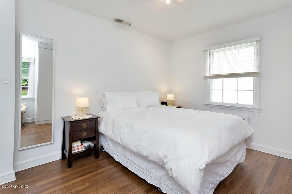 29 Long Meadow Road Riverside, CT 06878 - Photo 10 of 26 a bedroom with a bed and a window