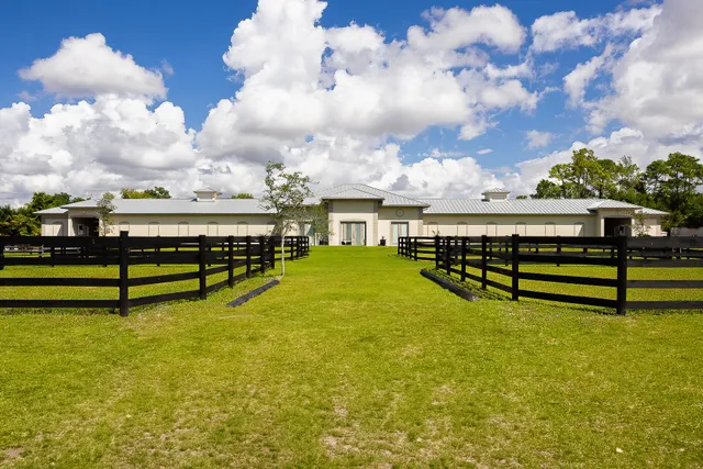 a view of a swimming pool with an outdoor seating and a yard
