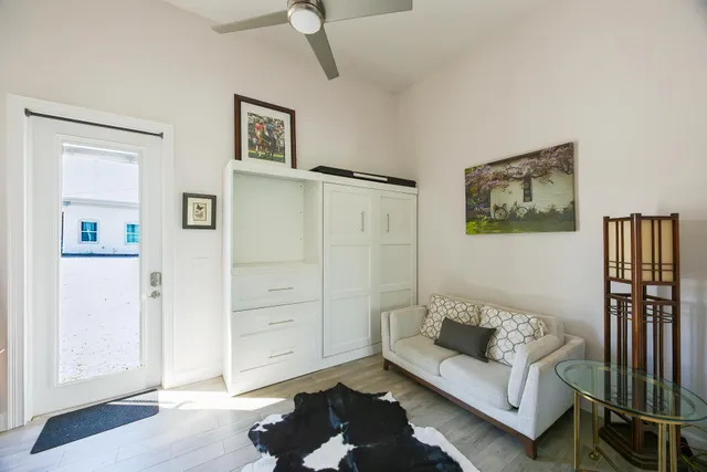 a living room with furniture and a rug