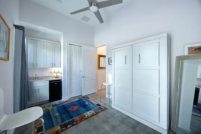 a bedroom with a bed and a bathroom